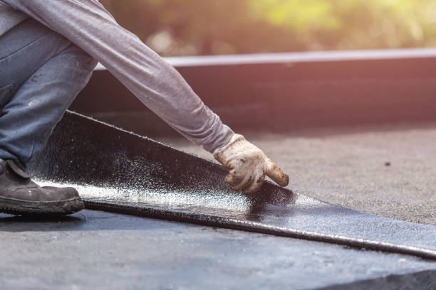 Professional Exterior Waterproofing technician working in Houghton, MI